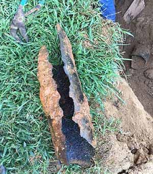 Degraded cast iron pipe causing massive blockage.